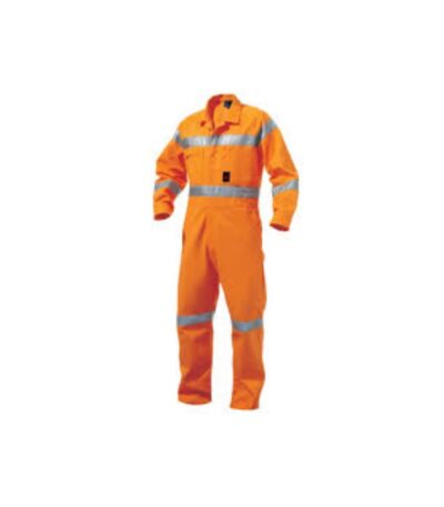 Worker wearing flame-resistant clothing in industrial welding environment